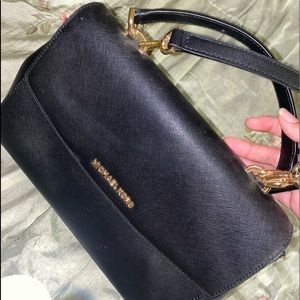 Black handbag/crossbody bag.